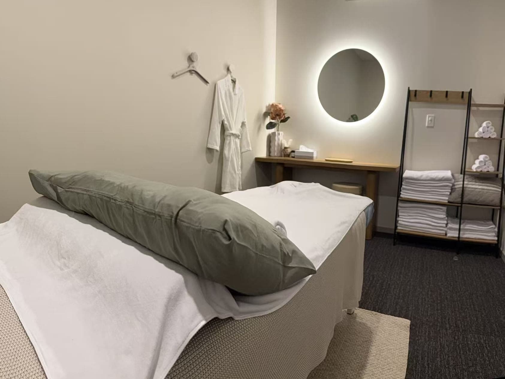 Fern & Soul remedial massage treatment room in Innaloo, Perth, with the table made up and a robe ready